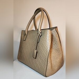 Henri bendel monogramed embossed leather tote in beige